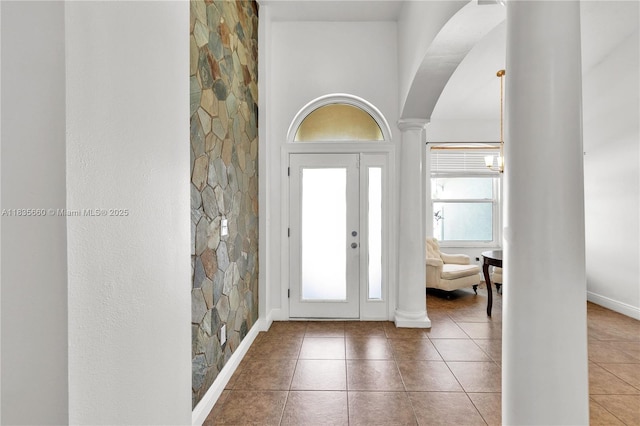 334 Colony St, Kissimmee, FL 34758 - tiled entrance foyer featuring decorative columns and arched walkways