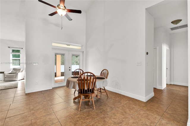 334 Colony St, Kissimmee, FL 34758 - dining room with high vaulted ceiling, ceiling fan, french doors, and tile patterned flooring
