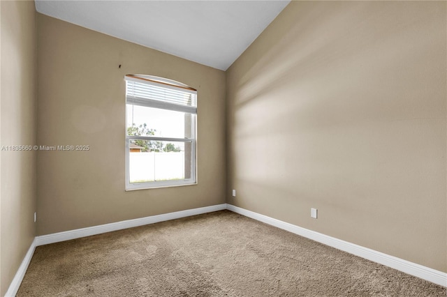 334 Colony St, Kissimmee, FL 34758 - carpeted empty room featuring baseboards and lofted ceiling