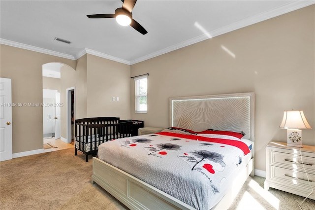 334 Colony St, Kissimmee, FL 34758 - bedroom featuring ornamental molding, light carpet, arched walkways, and ceiling fan