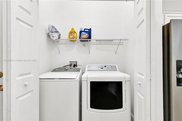 334 Colony St, Kissimmee, FL 34758 - laundry room featuring washing machine and clothes dryer