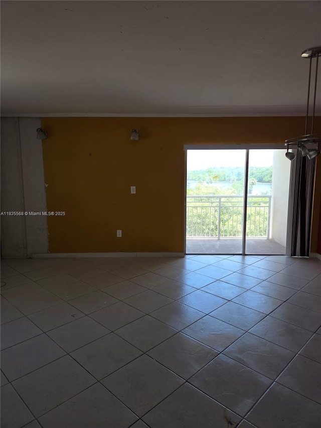 400 Kings Point Dr Unit 401, Sunny Isles Beach, FL 33160 - tiled empty room with ornamental molding and baseboards