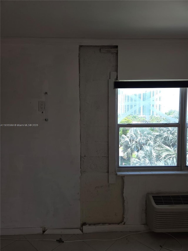 400 Kings Point Dr Unit 401, Sunny Isles Beach, FL 33160 - unfurnished room with tile patterned floors and a wall mounted air conditioner