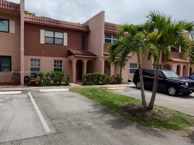 15 Laredo Pl Unit 2-7, Davie, FL 33324 - view of building exterior with uncovered parking