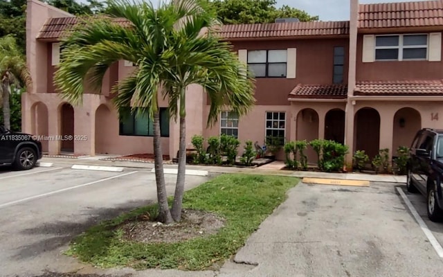 15 Laredo Pl Unit 2-7, Davie, FL 33324 - view of building exterior featuring uncovered parking