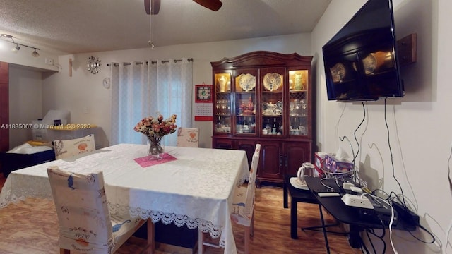 15 Laredo Pl Unit 2-7, Davie, FL 33324 - dining area with wood finished floors, a ceiling fan, and a textured ceiling