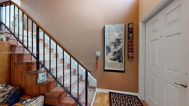 15 Laredo Pl Unit 2-7, Davie, FL 33324 - staircase featuring wood finished floors and a towering ceiling