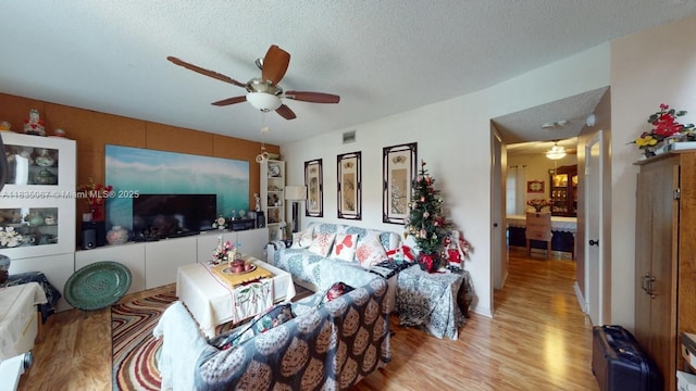 15 Laredo Pl Unit 2-7, Davie, FL 33324 - living area featuring a ceiling fan, light wood-type flooring, and a textured ceiling