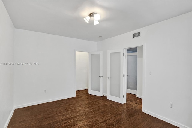 1616 Euclid Ave Unit 4, Miami Beach, FL 33139 - unfurnished bedroom with dark wood-type flooring and baseboards