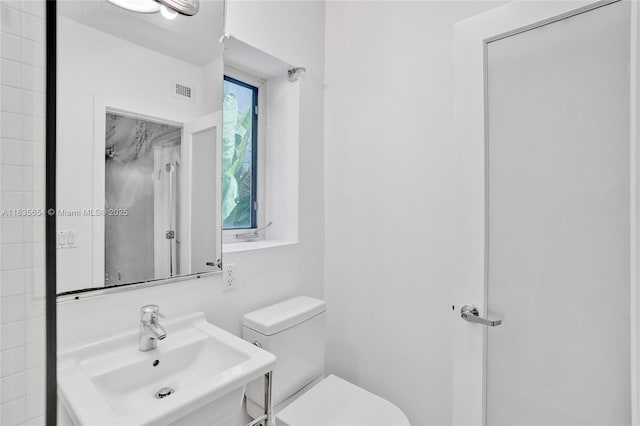 1616 Euclid Ave Unit 4, Miami Beach, FL 33139 - bathroom featuring toilet and a sink