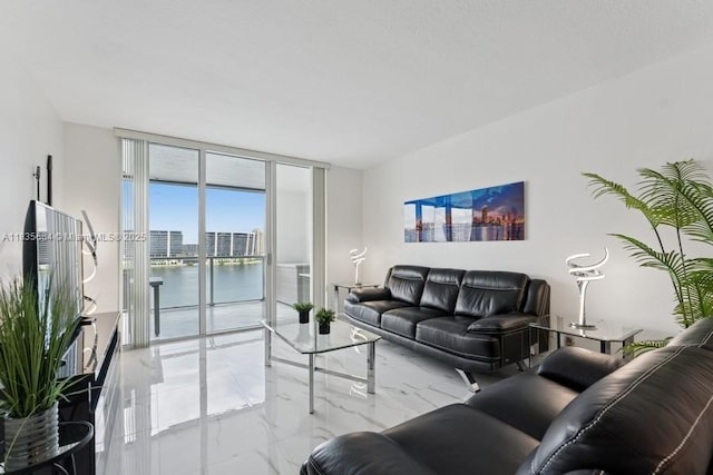 18100 N Bay Rd Unit 1108, Sunny Isles Beach, FL 33160 - living room featuring light marble finish flooring and expansive windows