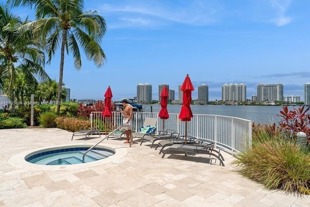 18100 N Bay Rd Unit 1108, Sunny Isles Beach, FL 33160 - view of swimming pool with a community hot tub, a view of skyline, a patio area, and a water view