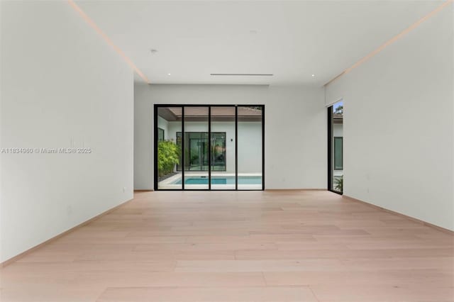 6445 SW 102nd Ave, Miami, FL 33173 - unfurnished room with light wood-type flooring and healthy amount of natural light