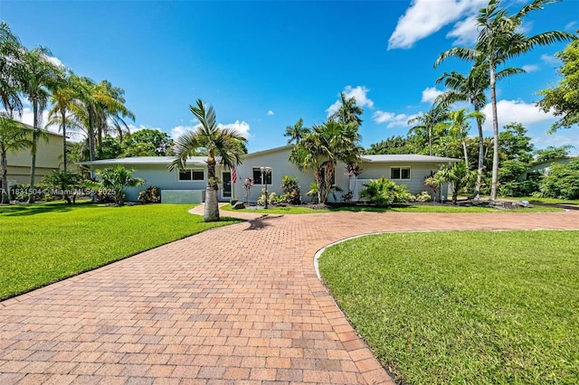 9720 SW 140th St, Miami, FL 33176 - view of front of house featuring decorative driveway, a front yard, and stucco siding