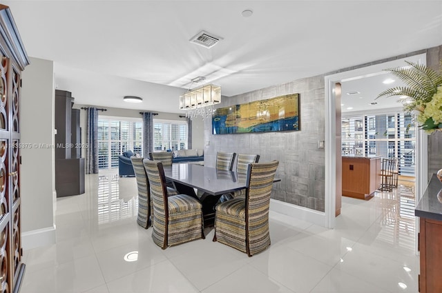 200 E Palmetto Park Rd Unit 714, Boca Raton, FL 33432 - dining space with a chandelier and light tile patterned floors
