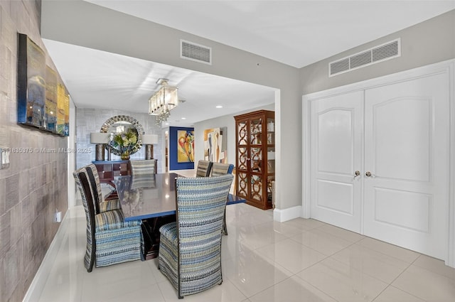 200 E Palmetto Park Rd Unit 714, Boca Raton, FL 33432 - tiled dining area featuring a chandelier and baseboards
