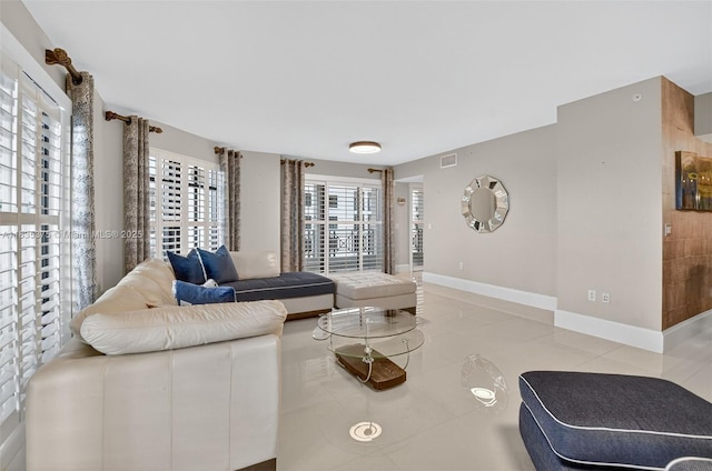 200 E Palmetto Park Rd Unit 714, Boca Raton, FL 33432 - living room featuring light tile patterned floors and baseboards