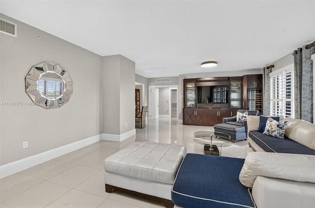 200 E Palmetto Park Rd Unit 714, Boca Raton, FL 33432 - living area featuring light tile patterned floors and baseboards