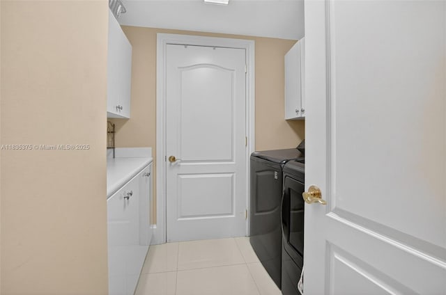 200 E Palmetto Park Rd Unit 714, Boca Raton, FL 33432 - washroom featuring cabinet space, washer and dryer, and tile patterned floors