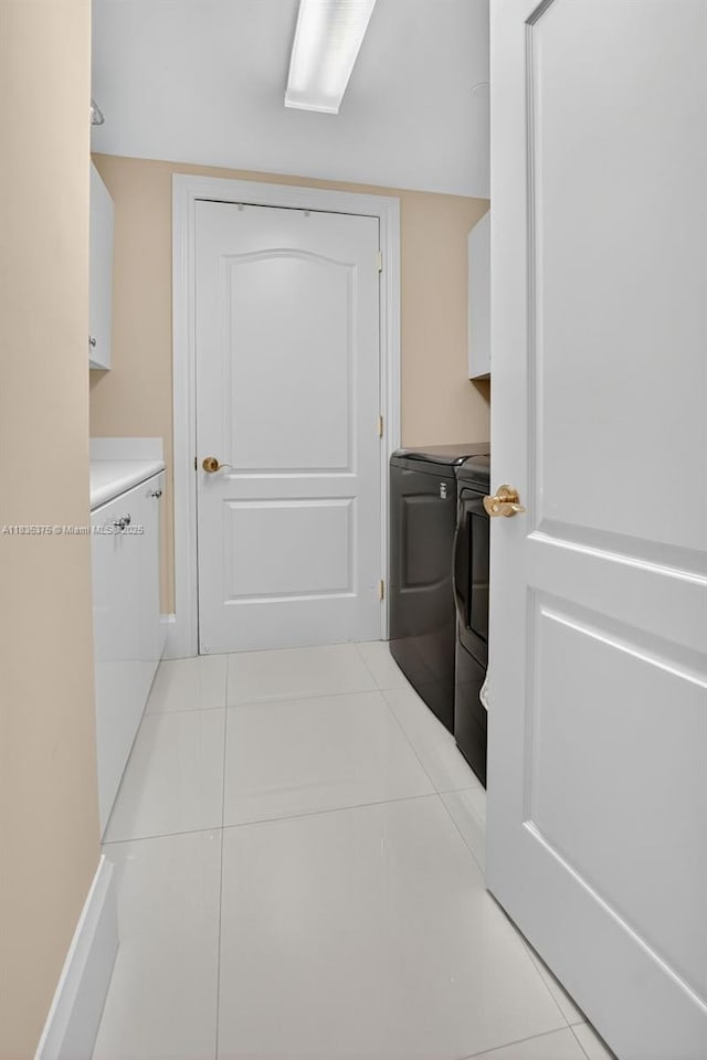 200 E Palmetto Park Rd Unit 714, Boca Raton, FL 33432 - laundry area featuring cabinet space, independent washer and dryer, and tile patterned flooring