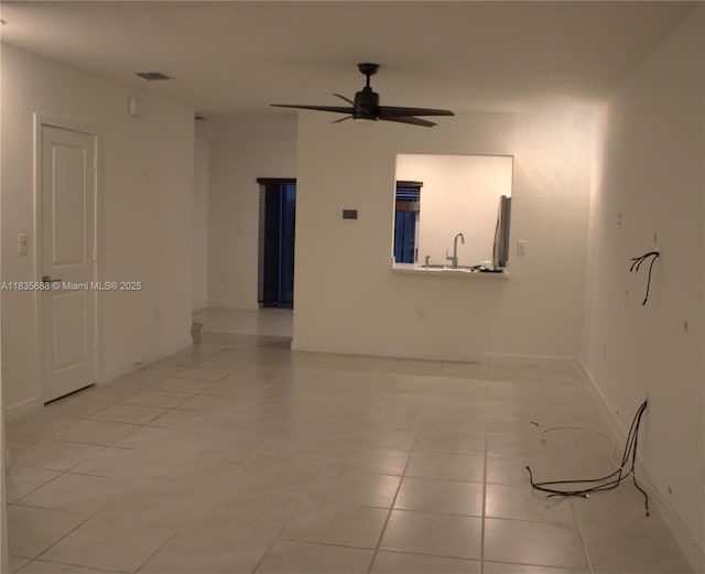 475 NE 5th Ln, Florida City, FL 33034 - spare room with a ceiling fan and light tile patterned floors