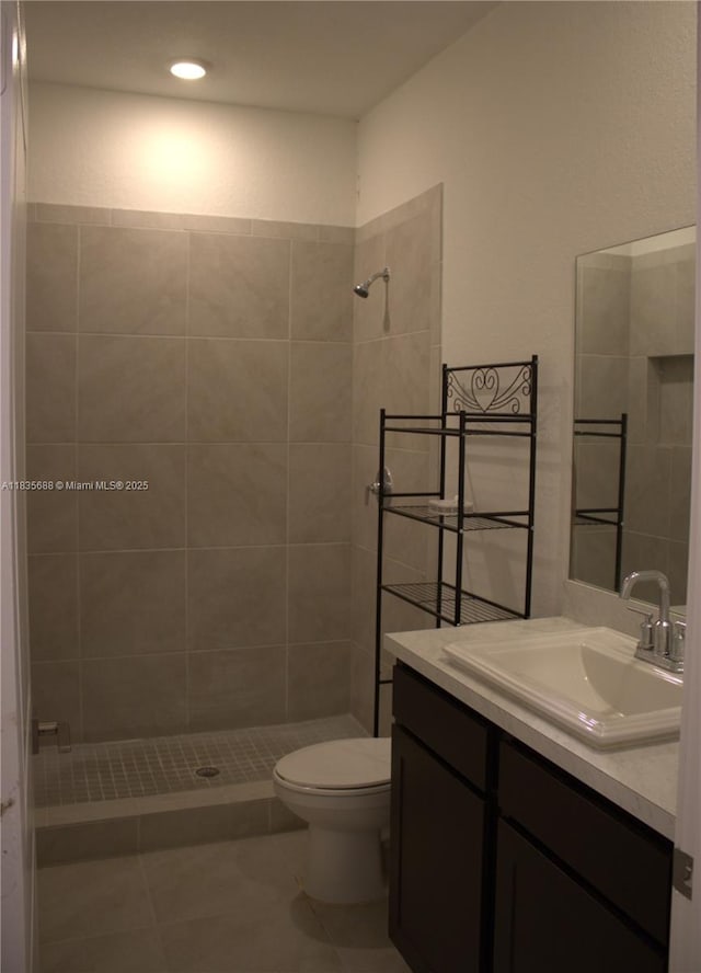 475 NE 5th Ln, Florida City, FL 33034 - bathroom with tiled shower, vanity, tile patterned flooring, and recessed lighting