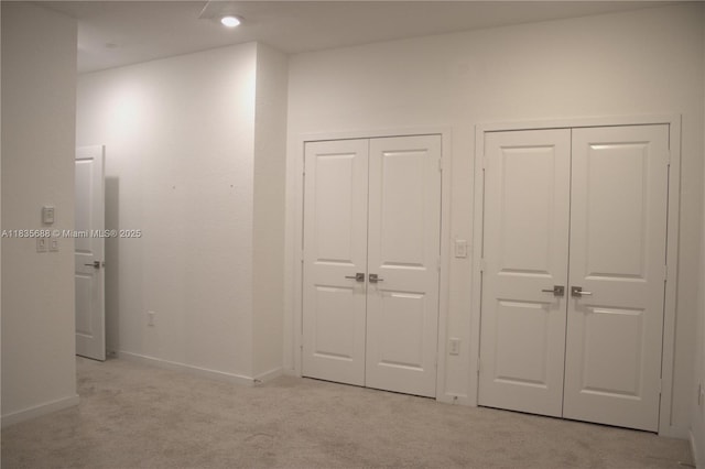 475 NE 5th Ln, Florida City, FL 33034 - unfurnished bedroom with two closets and light carpet