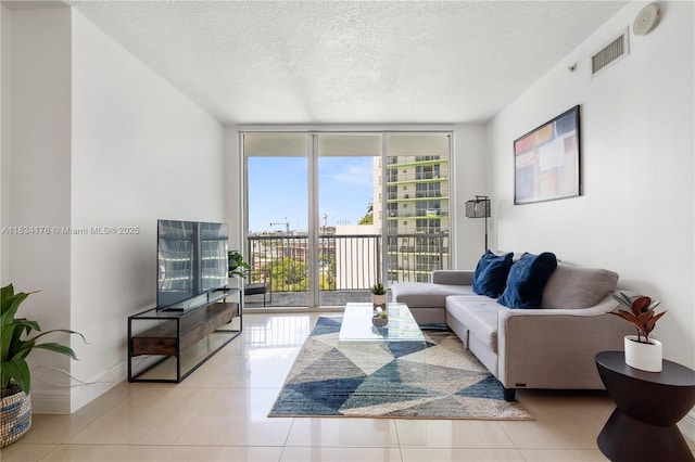 1750 N Bayshore Dr Unit 1611, Miami, FL 33132 - tiled living area featuring floor to ceiling windows and a textured ceiling