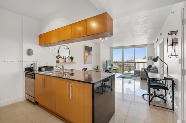 1750 N Bayshore Dr Unit 1611, Miami, FL 33132 - kitchen featuring stainless steel dishwasher, open floor plan, a peninsula, light tile patterned floors, and dark countertops