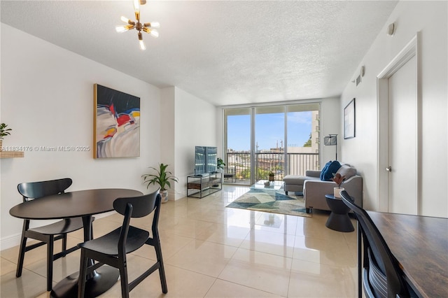 1750 N Bayshore Dr Unit 1611, Miami, FL 33132 - dining area featuring a textured ceiling, a chandelier, light tile patterned flooring, and floor to ceiling windows