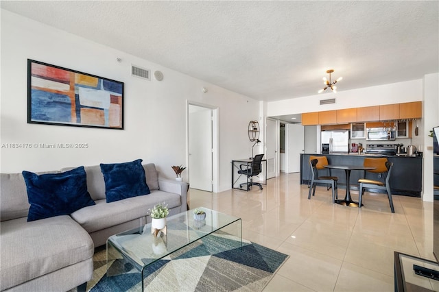 1750 N Bayshore Dr Unit 1611, Miami, FL 33132 - living room featuring a textured ceiling and light tile patterned floors