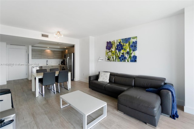 121 NE 34th St Unit 3012, Miami, FL 33137 - living room with light wood-style floors and baseboards
