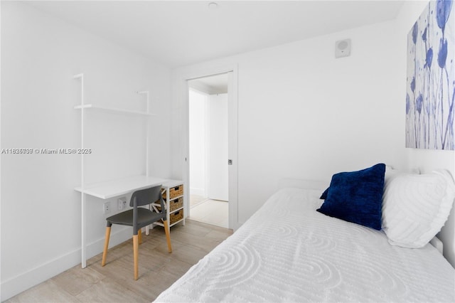 121 NE 34th St Unit 3012, Miami, FL 33137 - bedroom with light wood-type flooring and baseboards
