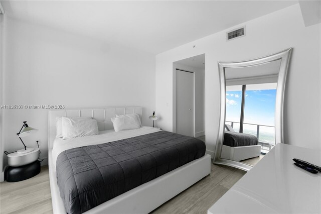 121 NE 34th St Unit 3012, Miami, FL 33137 - bedroom featuring wood finished floors