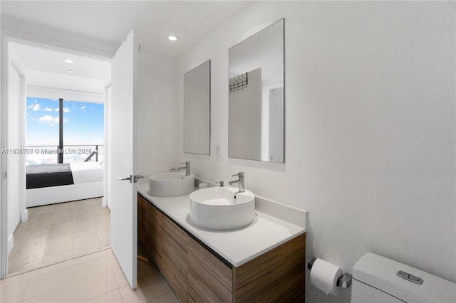 121 NE 34th St Unit 3012, Miami, FL 33137 - ensuite bathroom featuring double vanity, recessed lighting, and tile patterned floors