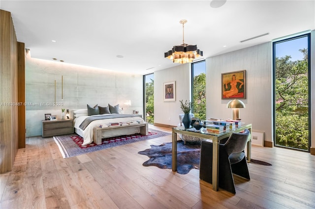 3910 Battersea Rd, Miami, FL 33133 - bedroom with expansive windows, a chandelier, multiple windows, and wood finished floors