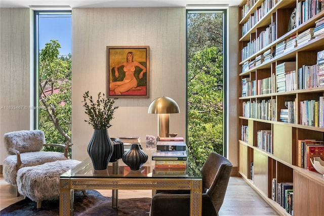 3910 Battersea Rd, Miami, FL 33133 - living area featuring a wall of windows and wood finished floors