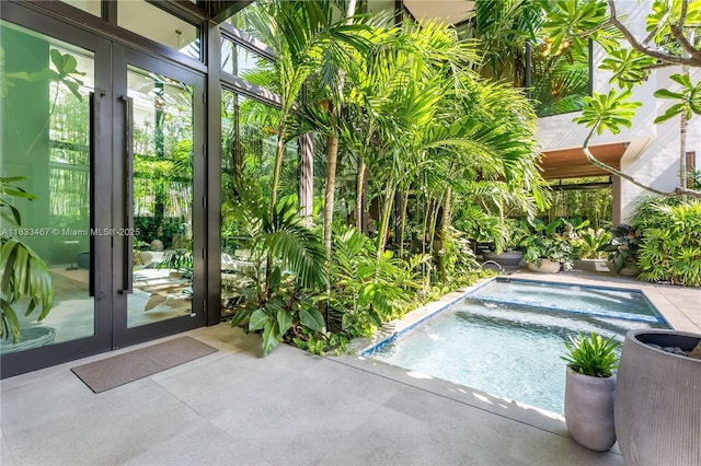 3910 Battersea Rd, Miami, FL 33133 - view of pool with french doors and an in-ground hot tub
