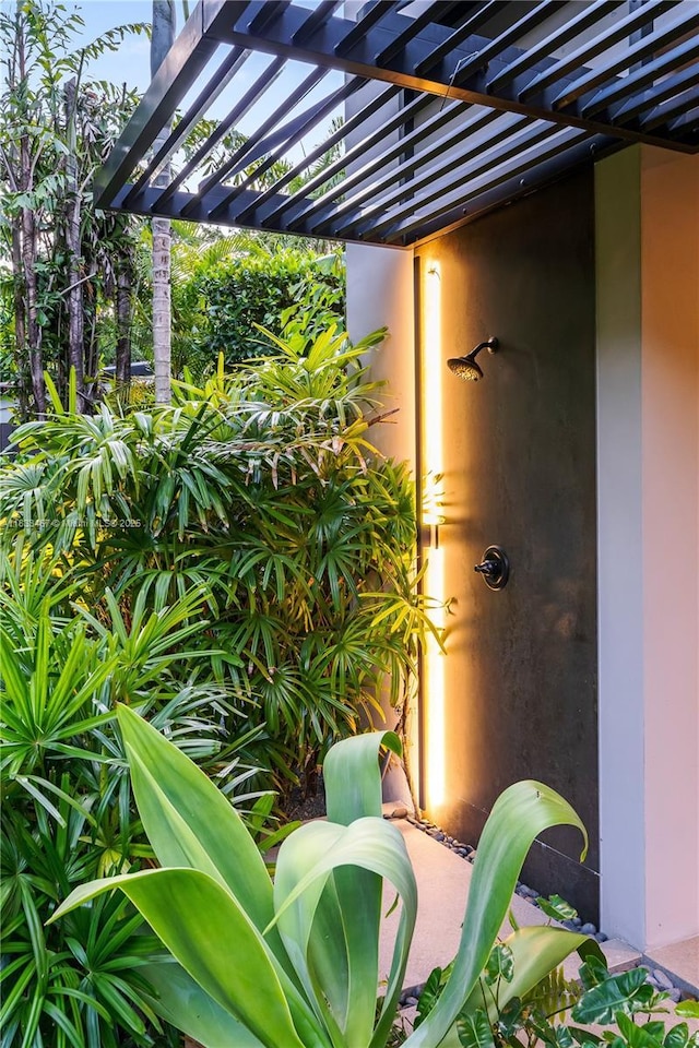 3910 Battersea Rd, Miami, FL 33133 - entrance to property featuring stucco siding and a pergola