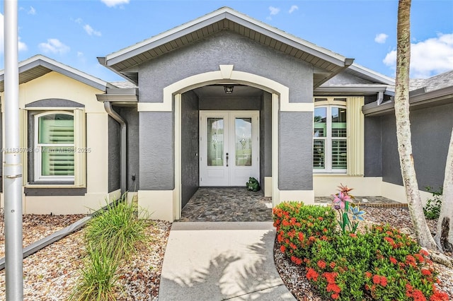 7130 Scarlet Sage Ct, Punta Gorda, FL 33955 - property entrance with stucco siding and french doors