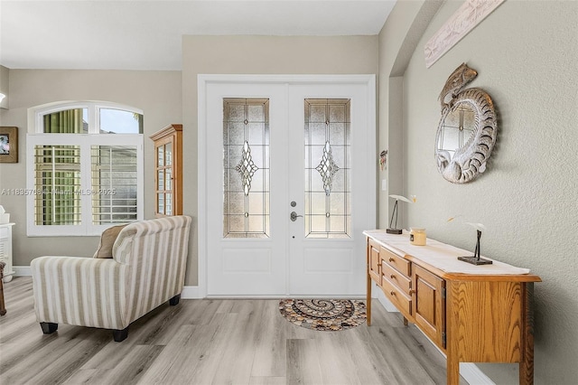 7130 Scarlet Sage Ct, Punta Gorda, FL 33955 - entrance foyer featuring light wood finished floors and french doors