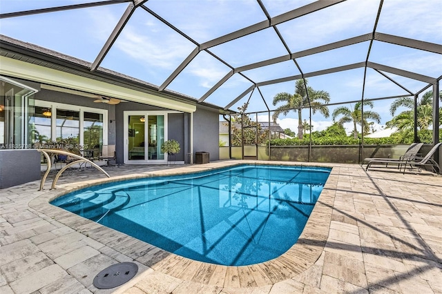 7130 Scarlet Sage Ct, Punta Gorda, FL 33955 - outdoor pool featuring a patio, ceiling fan, and glass enclosure