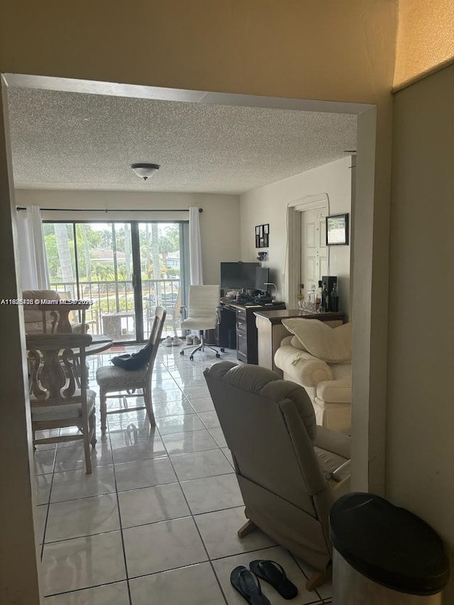 1001 Green Pine Blvd Unit H2, West Palm Beach, FL 33409 - living area featuring a textured ceiling and light tile patterned floors