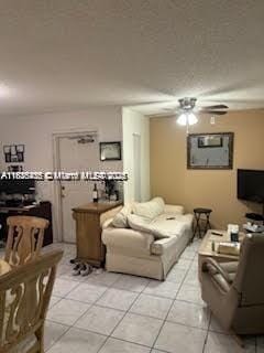1001 Green Pine Blvd Unit H2, West Palm Beach, FL 33409 - living area with light tile patterned floors and ceiling fan
