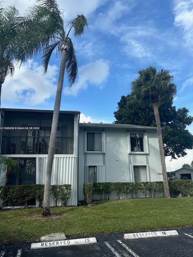1001 Green Pine Blvd Unit H2, West Palm Beach, FL 33409 - view of building exterior featuring uncovered parking