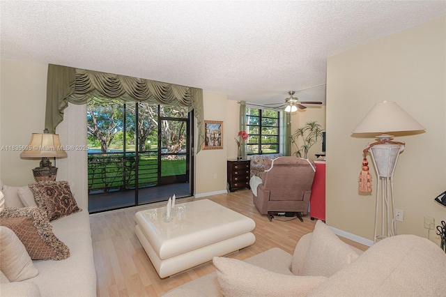 901 Colony Point Cir Unit 107, Pembroke Pines, FL 33026 - living room with wood finished floors, a textured ceiling, and a ceiling fan