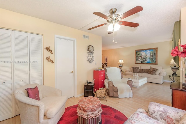 901 Colony Point Cir Unit 107, Pembroke Pines, FL 33026 - living room with light wood finished floors and a ceiling fan