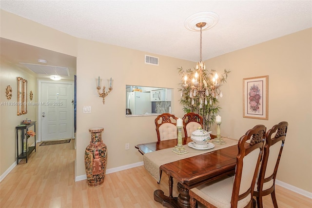 901 Colony Point Cir Unit 107, Pembroke Pines, FL 33026 - dining area featuring light wood-style floors and a chandelier