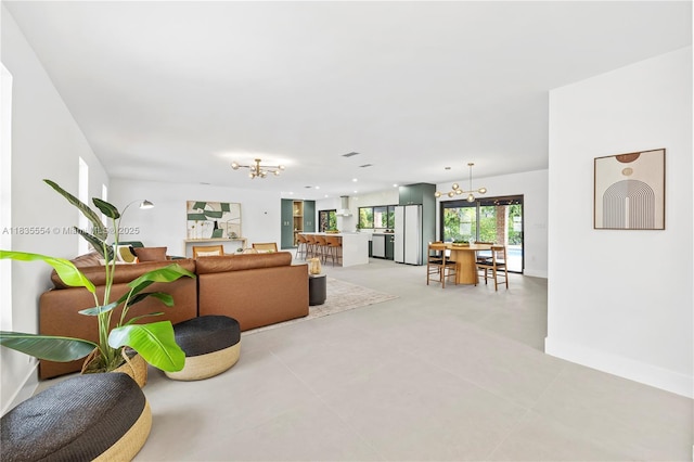 12505 SW 99th Ave, Miami, FL 33176 - living area featuring a chandelier and baseboards