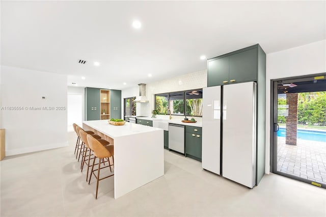 12505 SW 99th Ave, Miami, FL 33176 - kitchen featuring white appliances, light countertops, a kitchen island, a kitchen bar, and recessed lighting